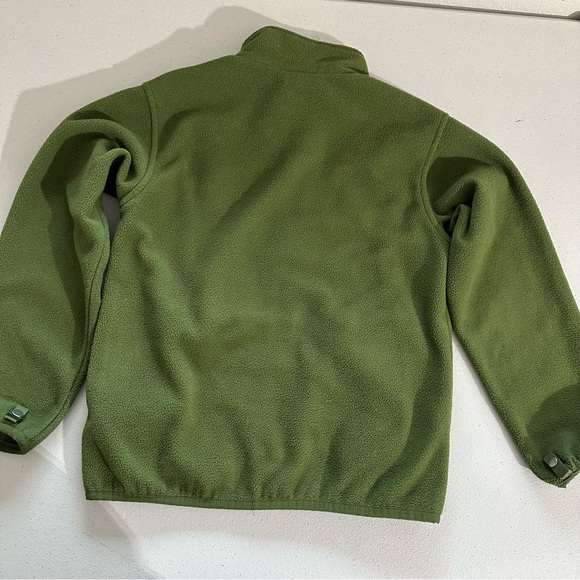 The North Face boys  full-zip fleece jacket in green with a neon yellow zipper. - Picture 2 of 6